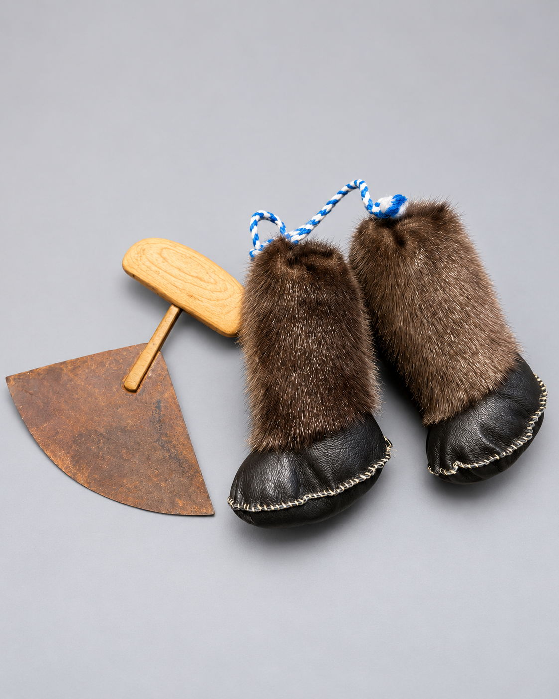 Detail of fur and hand-stitched leather boots